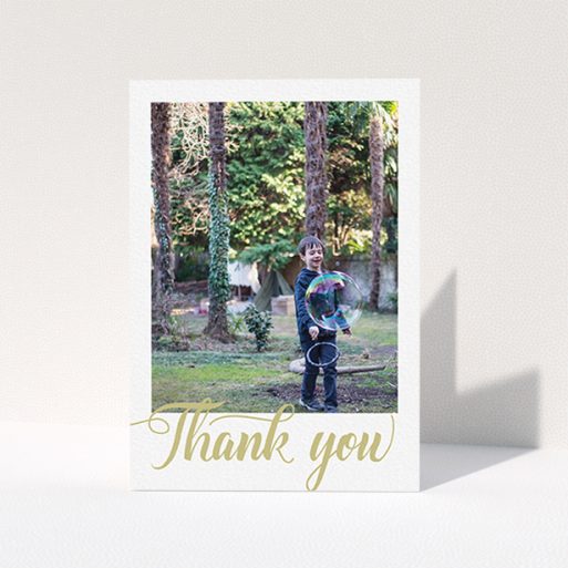 First Holy Communion Thank You Card Design - "Golden Thank You" A first holy communion thank you card design called "Golden Thank You". It is an A6 card in a portrait orientation. It is a photographic first holy communion thank you card with room for 1 photo. "Golden Thank You" is available as a folded card, with tones of cream and gold.