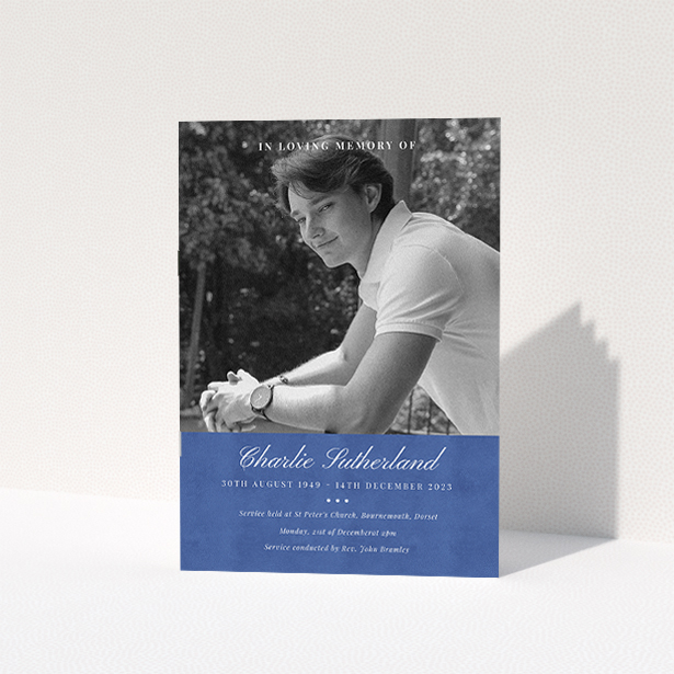 A funeral order of service named "Bold Elegance. It is an A5 booklet in a portrait orientation. It is a photographic funeral program with room for 1 photo. "Bold Elegance" is available as a folded booklet booklet, with splashes of navy blue.
