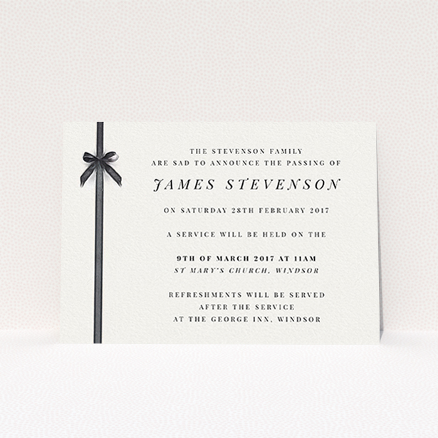 A funeral announcement card named "Gracefully tied". It is an A6 card in a landscape orientation. "Gracefully tied" is available as a flat card, with tones of pale cream and faded black.
