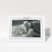 A funeral thank you card called "Remembered in flowers". It is an A6 card in a landscape orientation. It is a photographic funeral thank you card with room for 1 photo. "Remembered in flowers" is available as a folded card, with tones of white and blue.