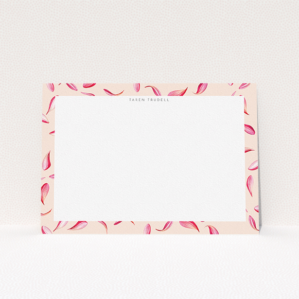 A ladies custom writing stationery design titled "Petal confetti". It is an A5 card in a landscape orientation. "Petal confetti" is available as a flat card, with tones of pink, red and white.