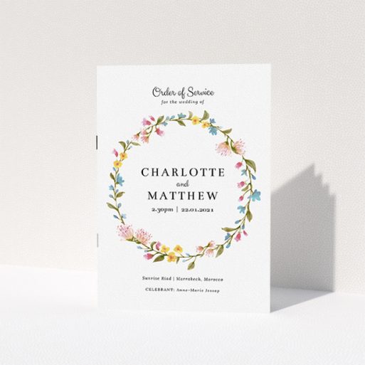 Multi-page Wedding Order of Service Design - "Spring Wedding Wreath" A multipage wedding order of service template titled "Spring Wedding Wreath". It is an A5 booklet in a portrait orientation. "Spring Wedding Wreath" is available as a folded booklet booklet, with mainly pink colouring.
