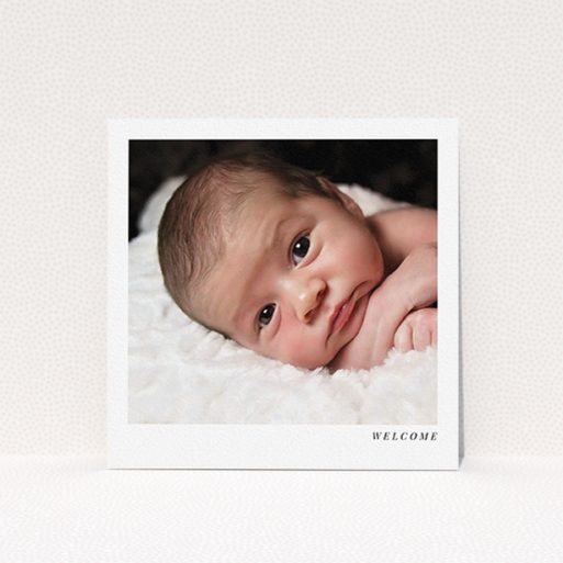 New Baby Announcement Card Design - "Welcome" A new baby announcement card named "Welcome". It is a square (148mm x 148mm) card in a square orientation. It is a photographic new baby announcement card with room for 1 photo. "Welcome" is available as a flat card, with mainly white colouring.