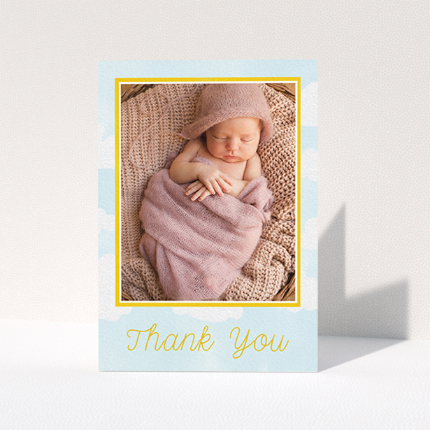 A new baby thank you card named "Blue Skies". It is an A6 card in a portrait orientation. It is a photographic new baby thank you card with room for 1 photo. "Blue Skies" is available as a folded card, with tones of blue and yellow.