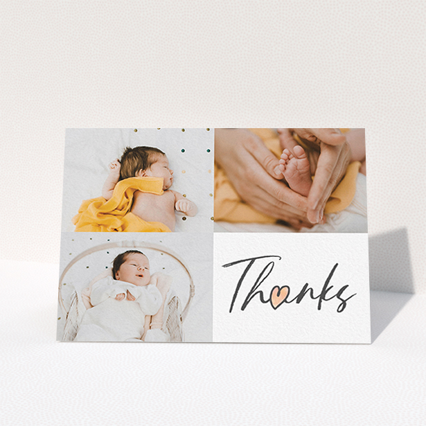A new baby thank you card named "Handwritten Heart". It is an A6 card in a landscape orientation. It is a photographic new baby thank you card with room for 3 photos. "Handwritten Heart" is available as a folded card, with tones of black and white.