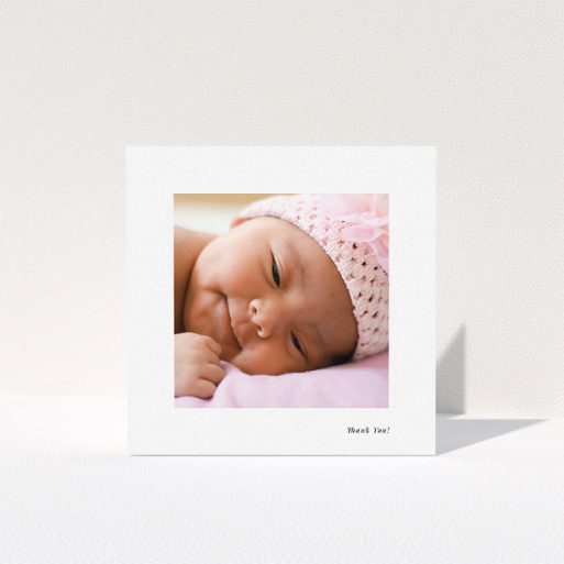 New Baby Thank You Card Design - "Thank You!" A new baby thank you card called "Thank You!". It is a square (148mm x 148mm) card in a square orientation. It is a photographic new baby thank you card with room for 1 photo. "Thank You!" is available as a folded card, with mainly white colouring.