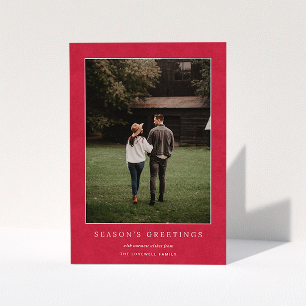 A personalised christmas card design named "Father C's Hat". It is an A5 card in a portrait orientation. It is a photographic personalised christmas card with room for 1 photo. "Father C's Hat" is available as a folded card, with tones of red and white.