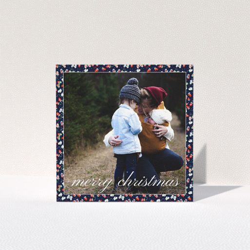 Personalised Christmas Card Design - "Many, Many, Mittens" A personalised christmas card design named "Many, Many, Mittens". It is a square (148mm x 148mm) card in a square orientation. It is a photographic personalised christmas card with room for 1 photo. "Many, Many, Mittens" is available as a folded card, with tones of navy blue, red and light blue.