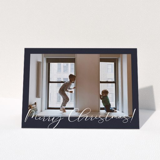 Personalised Christmas Card Design - "Moody Blue Crimbo" A personalised christmas card template titled "Moody Blue Crimbo". It is an A5 card in a landscape orientation. It is a photographic personalised christmas card with room for 1 photo. "Moody Blue Crimbo" is available as a folded card, with mainly white colouring.