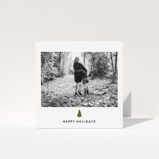 Personalised Christmas Card Design - "Painted Tree" A personalised christmas card template titled "Painted Tree". It is a square (148mm x 148mm) card in a square orientation. It is a photographic personalised christmas card with room for 1 photo. "Painted Tree" is available as a folded card, with tones of black and white.