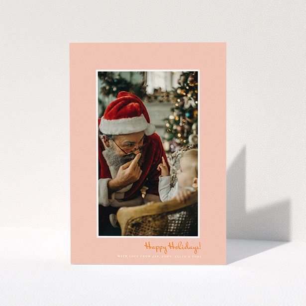 A personalised christmas card design titled "Smoked Salmon". It is an A5 card in a portrait orientation. It is a photographic personalised christmas card with room for 1 photo. "Smoked Salmon" is available as a folded card, with tones of pink and white.