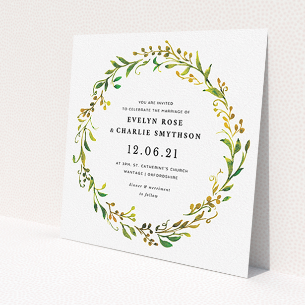 A personalised wedding invitation design titled "Autumn Floral Round". It is a square (148mm x 148mm) invite in a square orientation. "Autumn Floral Round" is available as a flat invite, with tones of green, orange and yellow.