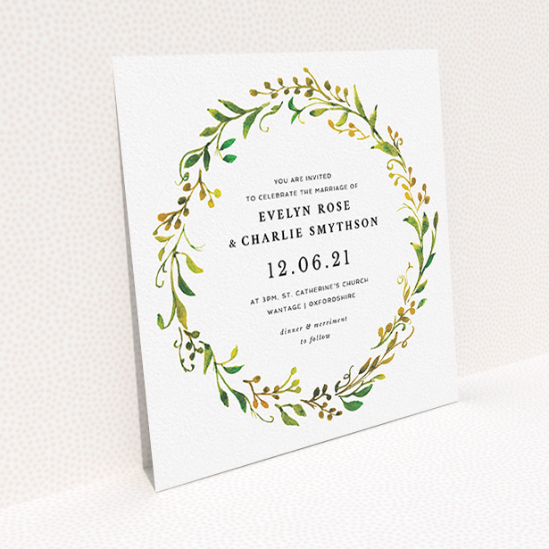 A personalised wedding invitation design titled "Autumn Floral Round". It is a square (148mm x 148mm) invite in a square orientation. "Autumn Floral Round" is available as a flat invite, with tones of green, orange and yellow.