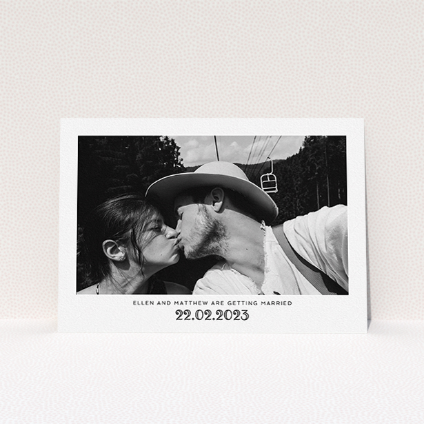A personalised wedding invitation named "Ornate Date". It is an A5 invite in a landscape orientation. It is a photographic personalised wedding invitation with room for 1 photo. "Ornate Date" is available as a flat invite, with mainly white colouring.