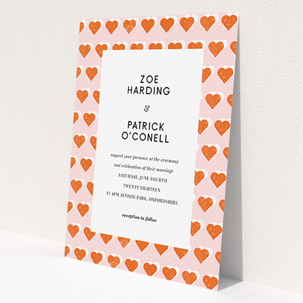 A personalised wedding invitation design called "Rustic Hearts". It is an A6 invite in a portrait orientation. "Rustic Hearts" is available as a flat invite, with tones of pink and orange.