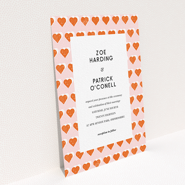 A personalised wedding invitation design called "Rustic Hearts". It is an A6 invite in a portrait orientation. "Rustic Hearts" is available as a flat invite, with tones of pink and orange.