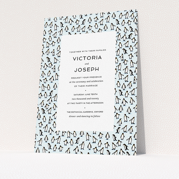 A personalised wedding invitation called "Tiny, Tiny Penguins". It is an A5 invite in a portrait orientation. "Tiny, Tiny Penguins" is available as a flat invite, with tones of blue and white.