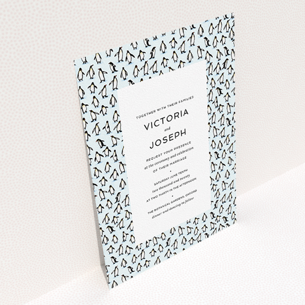 A personalised wedding invitation called "Tiny, Tiny Penguins". It is an A5 invite in a portrait orientation. "Tiny, Tiny Penguins" is available as a flat invite, with tones of blue and white.