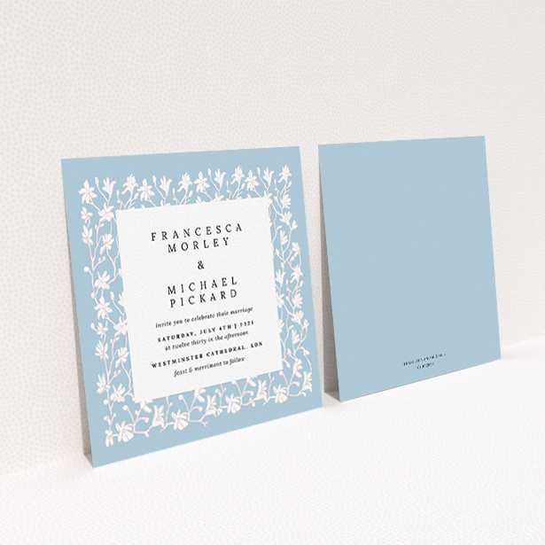 A personalised wedding invitation design named "White Ivy". It is a square (148mm x 148mm) invite in a square orientation. "White Ivy" is available as a flat invite, with tones of blue and white.