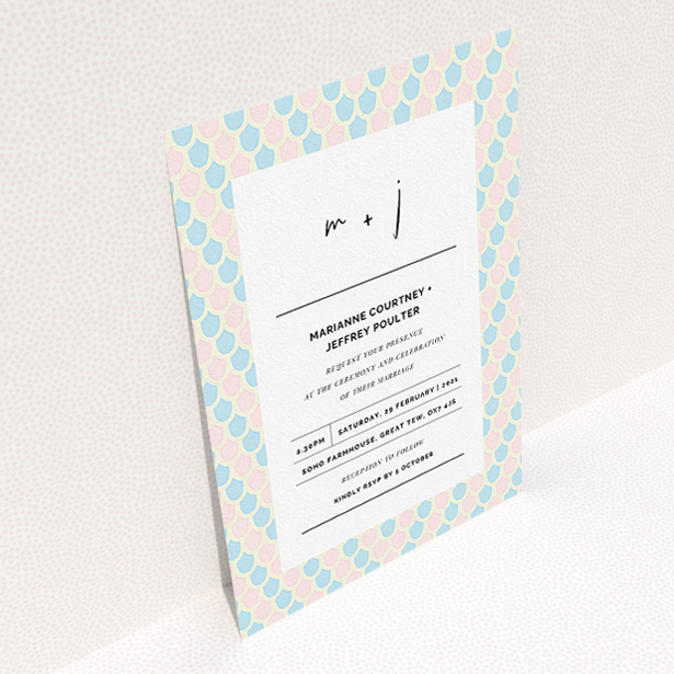 A personalised wedding invitation named "Worn Tiles". It is an A5 invite in a portrait orientation. "Worn Tiles" is available as a flat invite, with tones of pink, blue and cream.