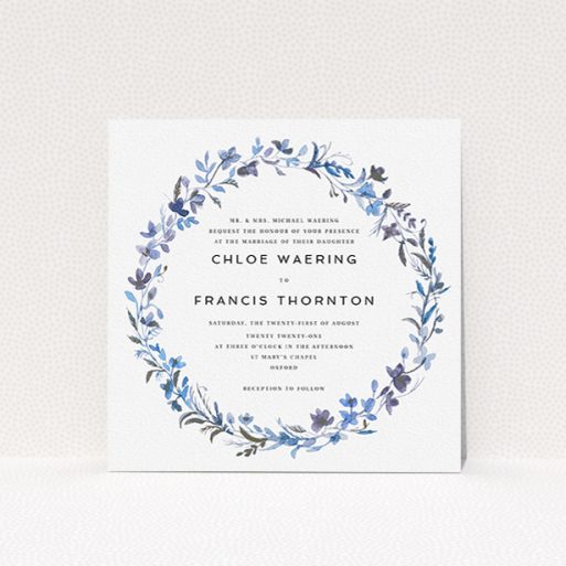 Personalised Wedding Invite Design - "Blue Floral Wreath" A personalised wedding invite design titled "Blue Floral Wreath". It is a square (148mm x 148mm) invite in a square orientation. "Blue Floral Wreath" is available as a flat invite, with tones of light blue, purple and grey.