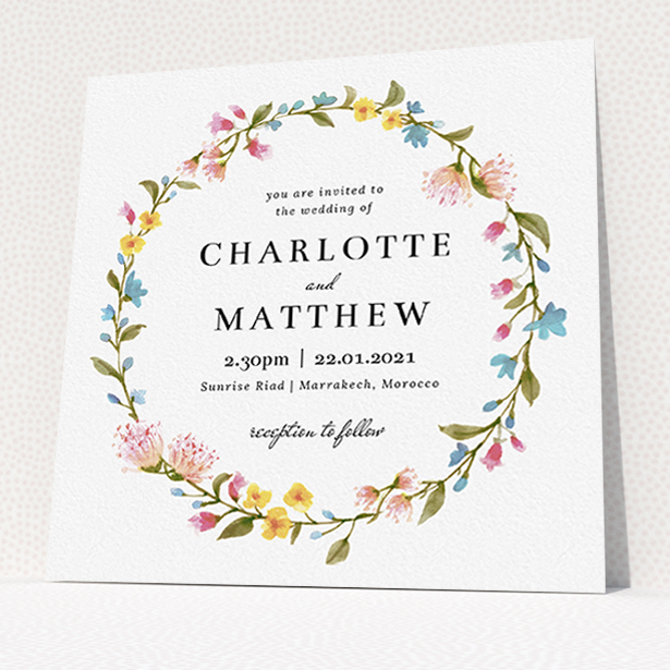 A personalised wedding invite template titled "Spring Wreath". It is a square (148mm x 148mm) invite in a square orientation. "Spring Wreath" is available as a flat invite, with mainly pink colouring.