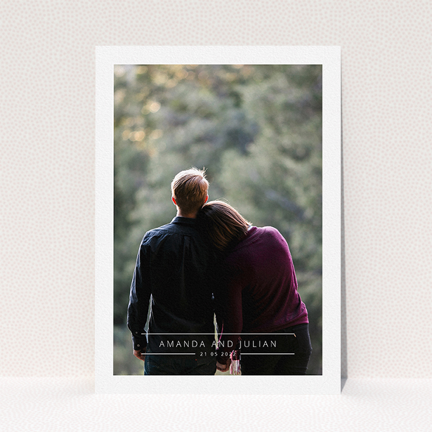 A personalised wedding invite template titled "Tramlines". It is an A5 invite in a portrait orientation. It is a photographic personalised wedding invite with room for 1 photo. "Tramlines" is available as a flat invite, with mainly white colouring.