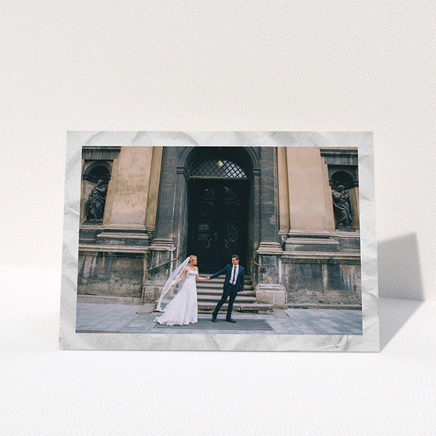 A photo wedding thank you card named "Sat on Marble". It is an A5 card in a landscape orientation. It is a photographic photo wedding thank you card with room for 1 photo. "Sat on Marble" is available as a folded card, with mainly white colouring.