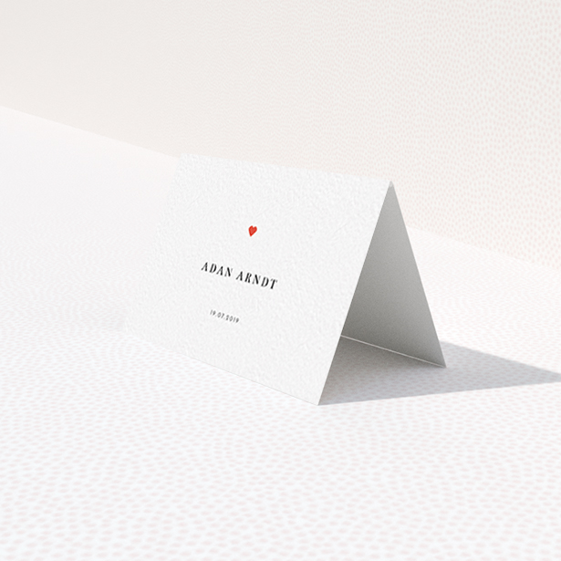 A place setting card design titled "A little heart". It is an 85 x 55mm card in a landscape orientation. "A little heart" is available as a folded card, with tones of white and red.
