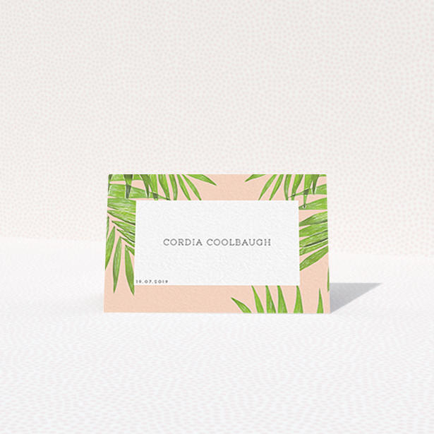 A place setting card design called "In the courtyard". It is an 85 x 55mm card in a landscape orientation. "In the courtyard" is available as a folded card, with tones of green and pink.