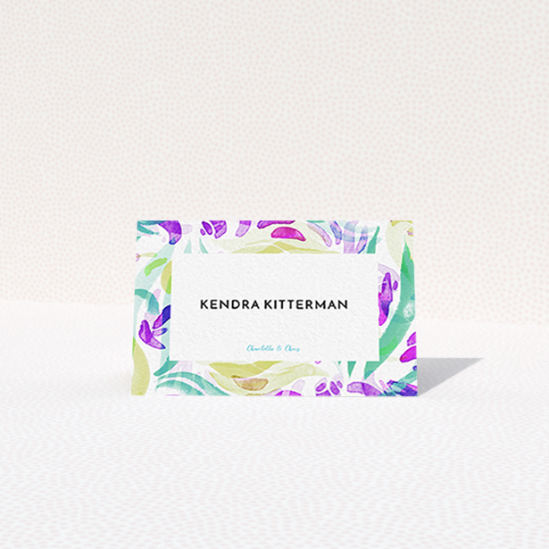 A place setting card design titled "Neon Florals". It is an 85 x 55mm card in a landscape orientation. "Neon Florals" is available as a folded card, with tones of white, green and pink.
