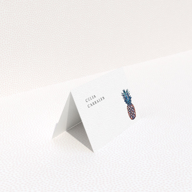 A place setting card design called "One Little Pineapple". It is an 85 x 55mm card in a landscape orientation. "One Little Pineapple" is available as a folded card, with tones of white and green.