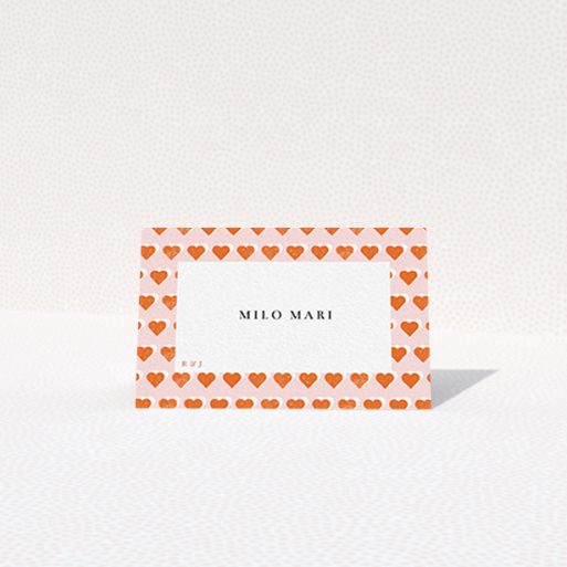 Place Setting Card Design - "Rustic Hearts" A place setting card design named "Rustic Hearts". It is an 85 x 55mm card in a landscape orientation. "Rustic Hearts" is available as a folded card, with tones of pink and orange.