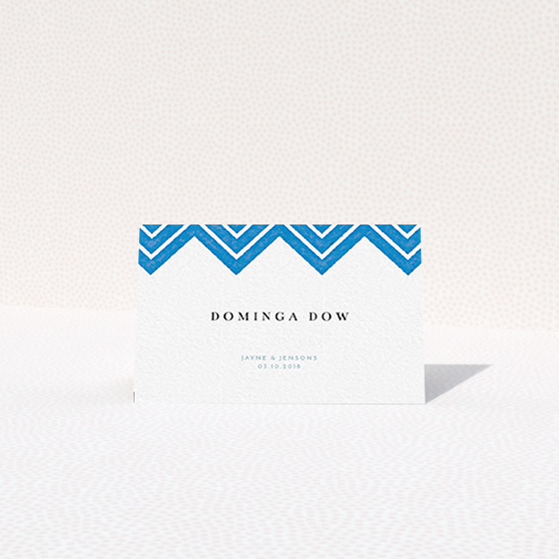 A place setting card named "Skiapthos". It is an 85 x 55mm card in a landscape orientation. "Skiapthos" is available as a folded card, with tones of blue and white.