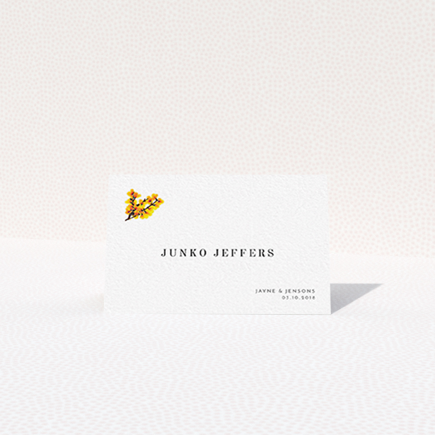 A table place card design titled "Autumn Blossom". It is an 85 x 55mm card in a landscape orientation. "Autumn Blossom" is available as a folded card, with tones of white and orange.