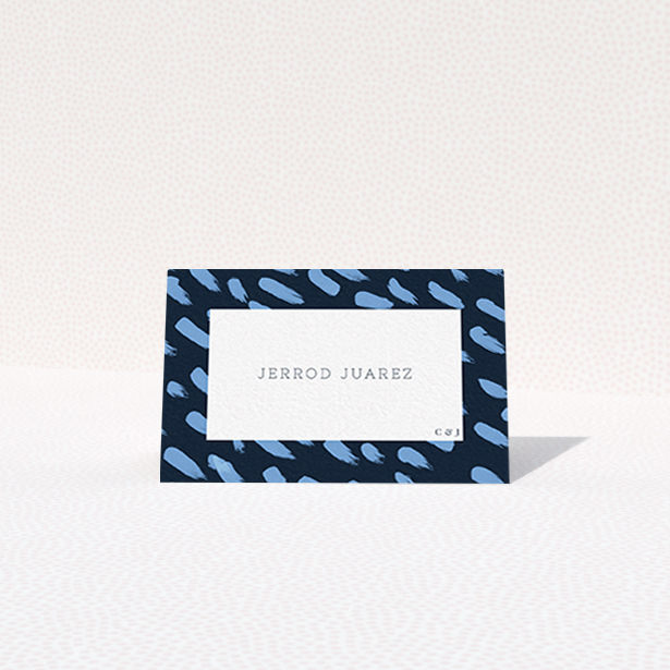 A table place card design titled "Blue strokes". It is an 85 x 55mm card in a landscape orientation. "Blue strokes" is available as a folded card, with tones of blue and white.