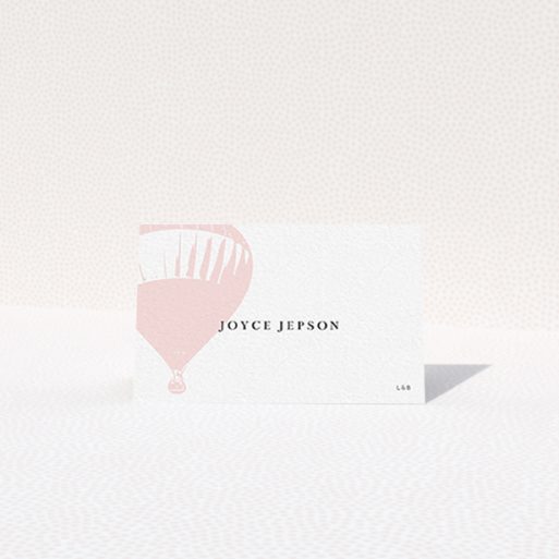 Table Place Card Design - "Drifting Away" A table place card design named "Drifting Away". It is an 85 x 55mm card in a landscape orientation. "Drifting Away" is available as a folded card, with tones of pink and white.