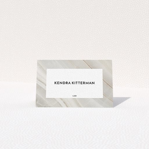 Table Place Card Design - "Marble Swerve" A table place card design titled "Marble Swerve". It is an 85 x 55mm card in a landscape orientation. "Marble Swerve" is available as a folded card, with tones of grey and white.