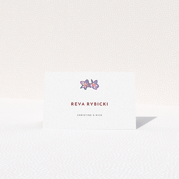 A table place card template titled "Two little Orchids". It is an 85 x 55mm card in a landscape orientation. "Two little Orchids" is available as a folded card, with tones of white and purple.