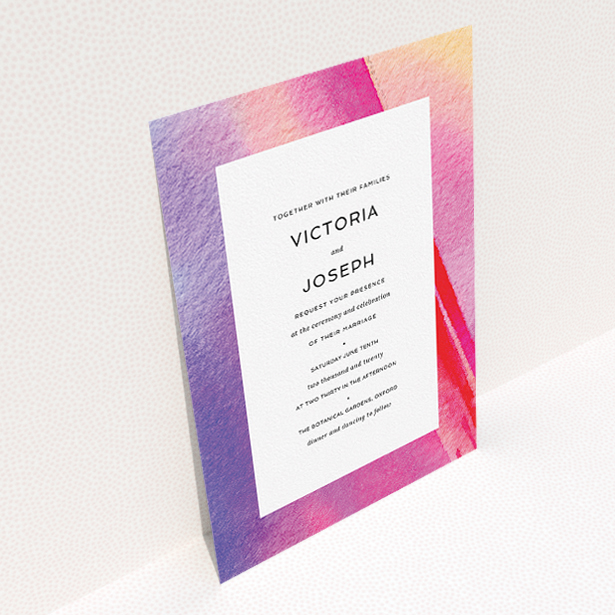 A wedding invite card design called "Abstract Pink Watercolour". It is an A5 invite in a portrait orientation. "Abstract Pink Watercolour" is available as a flat invite, with tones of vibrant pink, purple and red.