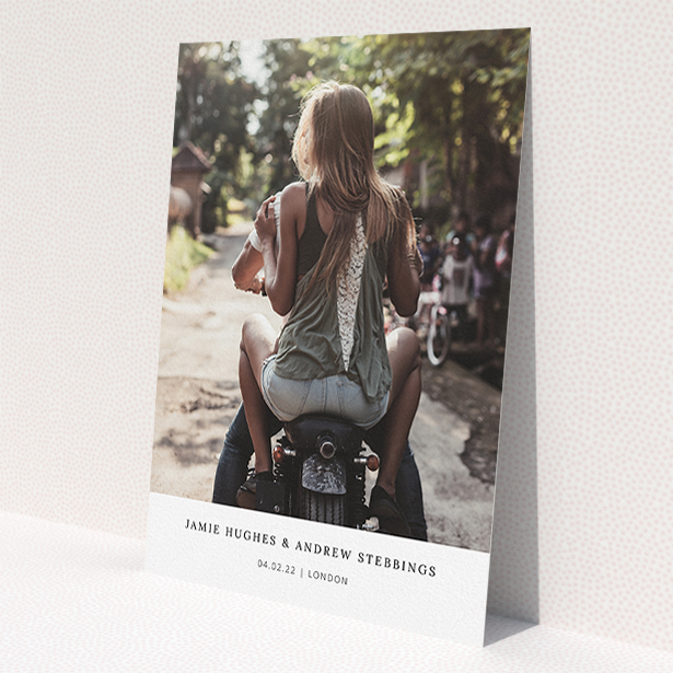 A wedding invite card named "Maddox Street". It is an A5 invite in a portrait orientation. It is a photographic wedding invite card with room for 1 photo. "Maddox Street" is available as a flat invite, with mainly white colouring.