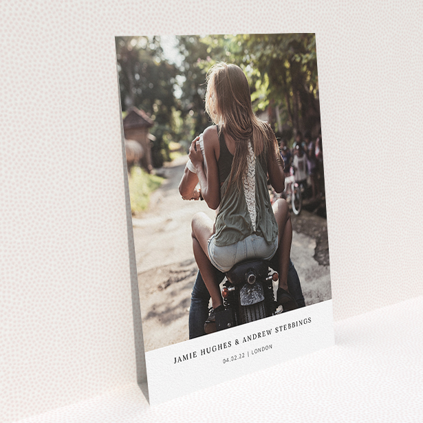 A wedding invite card named "Maddox Street". It is an A5 invite in a portrait orientation. It is a photographic wedding invite card with room for 1 photo. "Maddox Street" is available as a flat invite, with mainly white colouring.