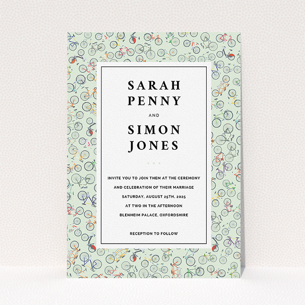 A wedding invite card named "Peloton". It is an A5 invite in a portrait orientation. "Peloton" is available as a flat invite, with tones of green, red and grey.