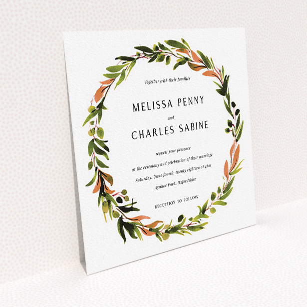 A wedding invite card design called "Watercolour Olive Wreath". It is a square (148mm x 148mm) invite in a square orientation. "Watercolour Olive Wreath" is available as a flat invite, with tones of green, dark green and terracotta.
