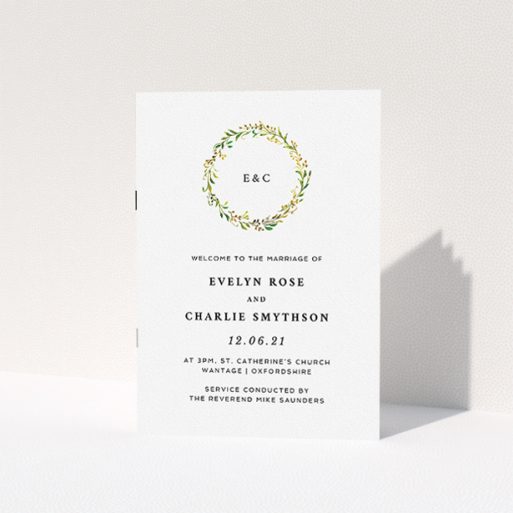Wedding Order Of Service Design - "Classic Monogrammed Wreath" A wedding order of service called "Classic Monogrammed Wreath". It is an A5 booklet in a portrait orientation. "Classic Monogrammed Wreath" is available as a folded booklet booklet, with tones of white and green.
