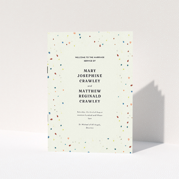 A wedding order of service template titled "Crayon splinters". It is an A5 booklet in a portrait orientation. "Crayon splinters" is available as a folded booklet booklet, with tones of pale cream and orange.