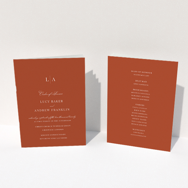 A wedding order of service named "Dark Ochre Monogrammed". It is an A5 booklet in a portrait orientation. "Dark Ochre Monogrammed" is available as a folded booklet booklet, with mainly dark orange colouring.