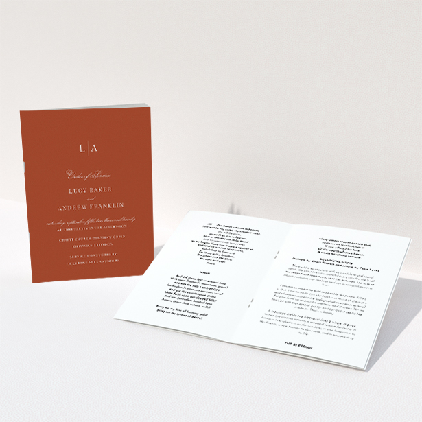 A wedding order of service named "Dark Ochre Monogrammed". It is an A5 booklet in a portrait orientation. "Dark Ochre Monogrammed" is available as a folded booklet booklet, with mainly dark orange colouring.