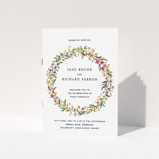 Wedding Order Of Service Design - "Spring Wildflower" A wedding order of service named "Spring Wildflower". It is an A5 booklet in a portrait orientation. "Spring Wildflower" is available as a folded booklet booklet, with tones of light green and orange.