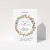 A wedding order of service named "Spring Wildflower". It is an A5 booklet in a portrait orientation. "Spring Wildflower" is available as a folded booklet booklet, with tones of light green and orange.